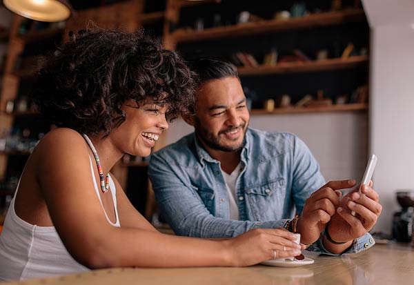 couple-looking-at-phone